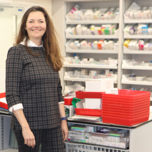 Michelle Taylor-Siddons stands in a hospital pharmacy.