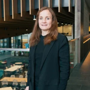 Image of Benita Oliver dressed in black, in an office.