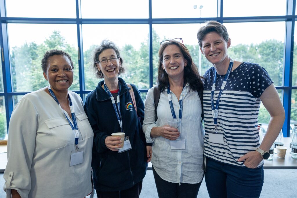 People pose together at a conference.