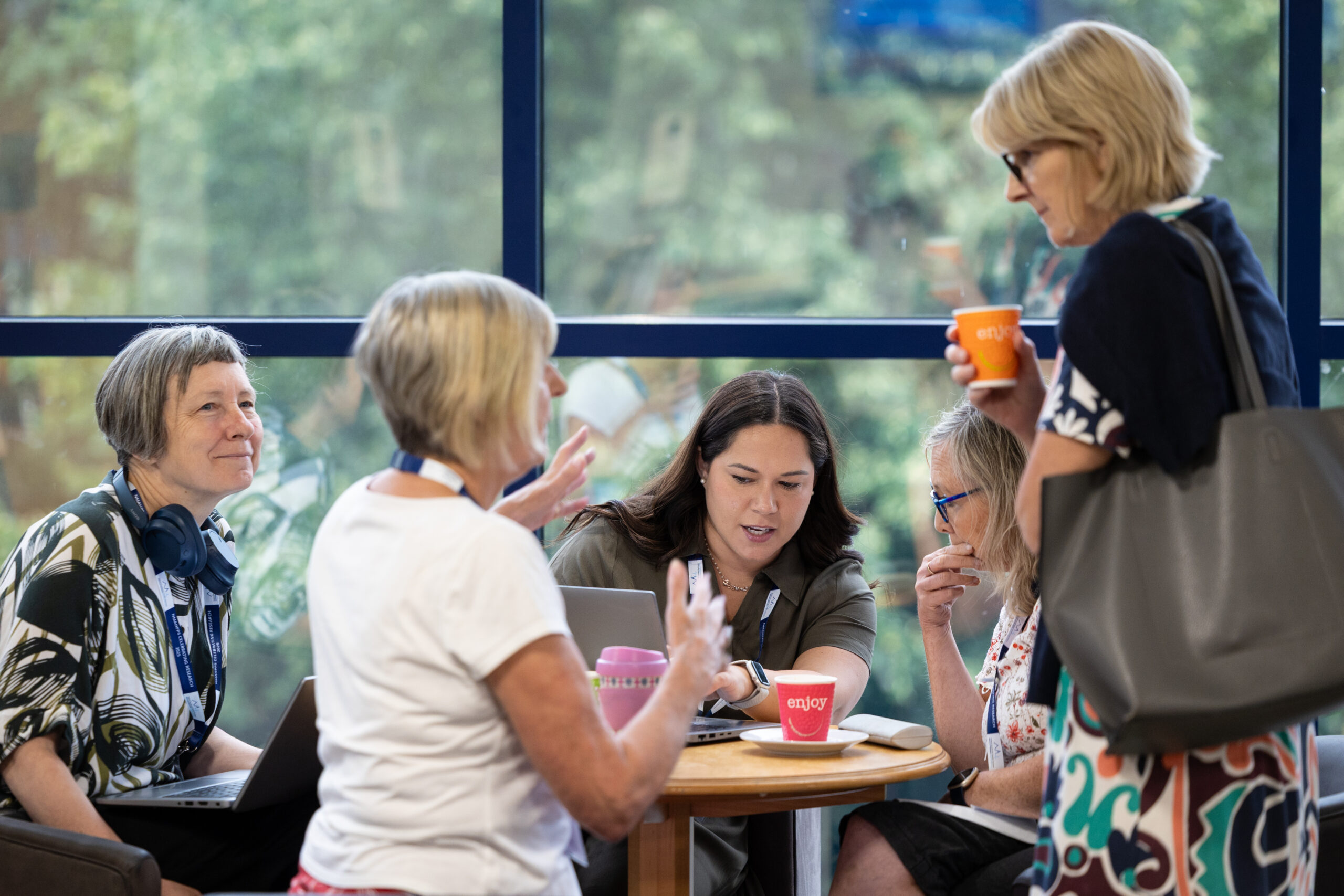 People speaking together at a conference